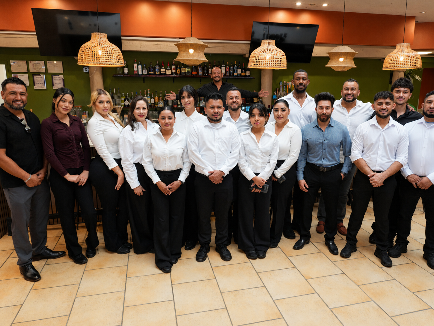 The La Fogata Table team posing together by the bar