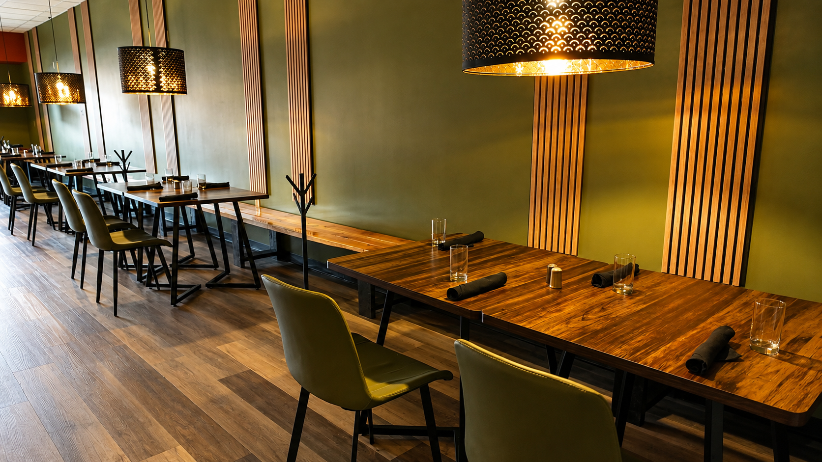 The empty dining room set for service with pendant lights